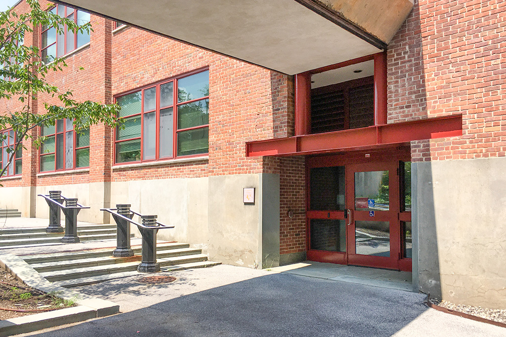 A building with red doors and stairs.
