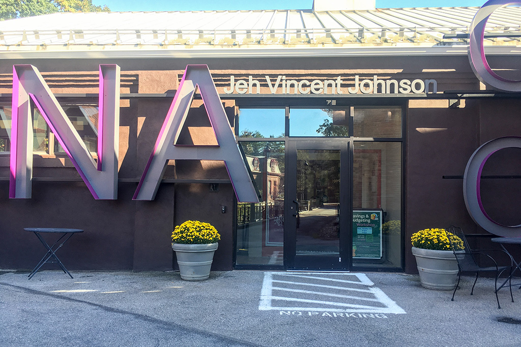 The upper level entrance (nearest the Powerhouse Theater) features a single door.