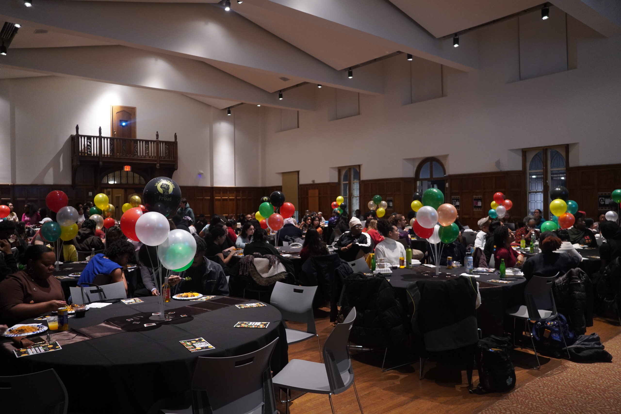 Attendees seated at tables looking at the front of the Villard.