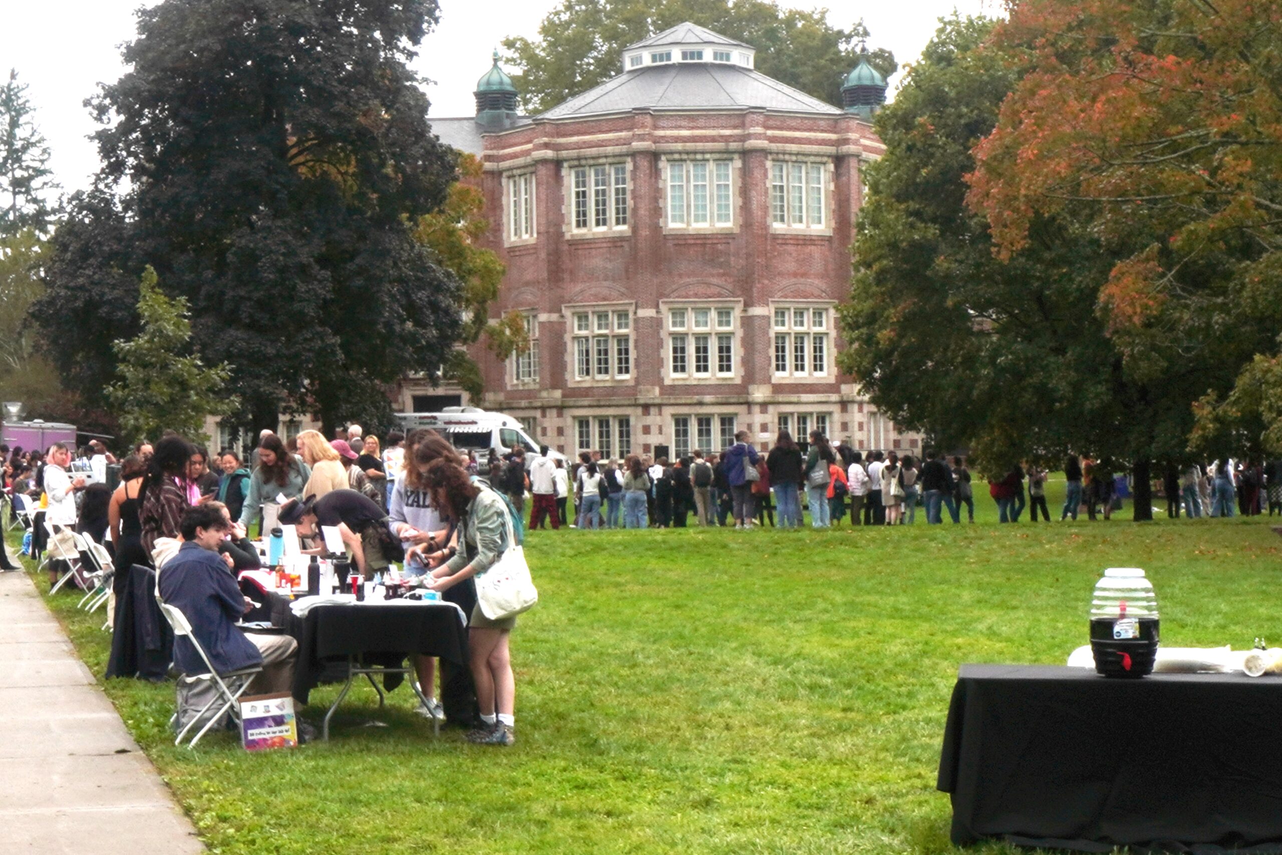 ALANA Fest 2023 located in on the grass of the Res Quad, with tabling and people lined up for food and to view the performances. 