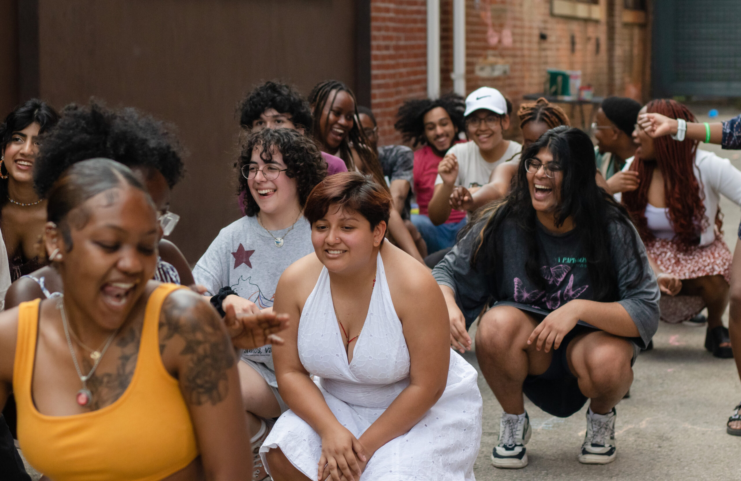 Students dancing in the alleyway of the ALANA Center.
