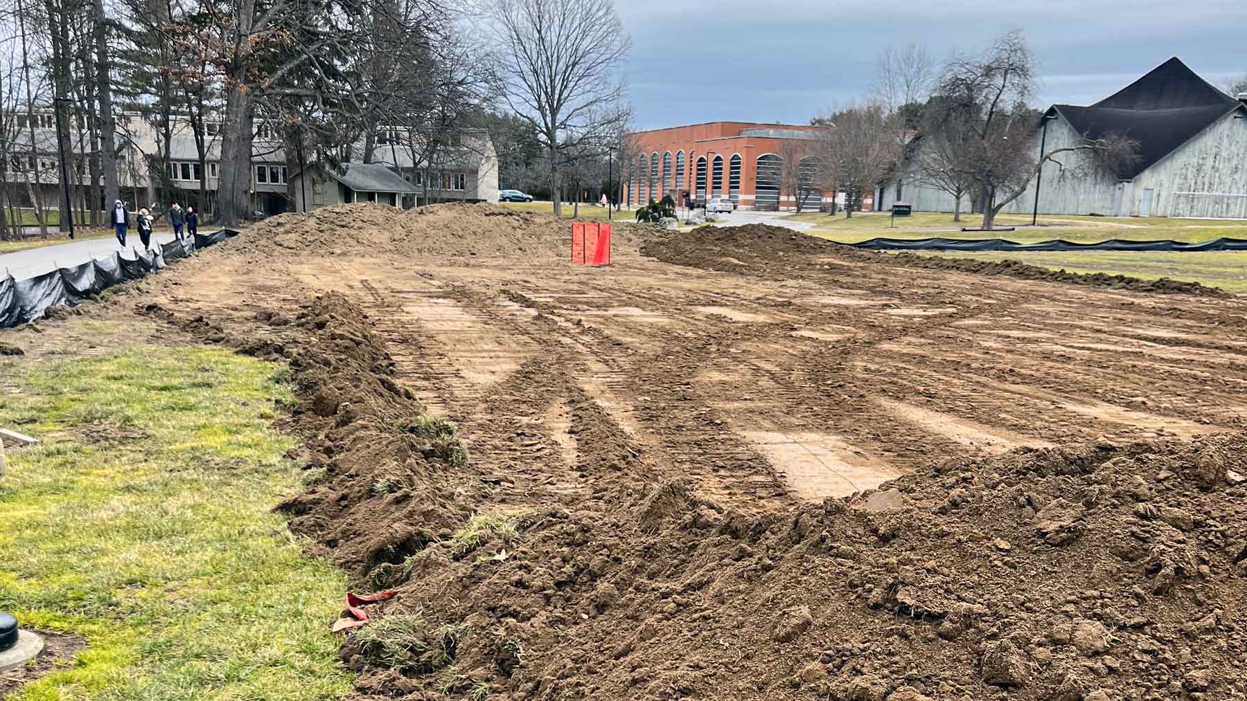 Construction site with a bull dozed area exposing fresh dirt