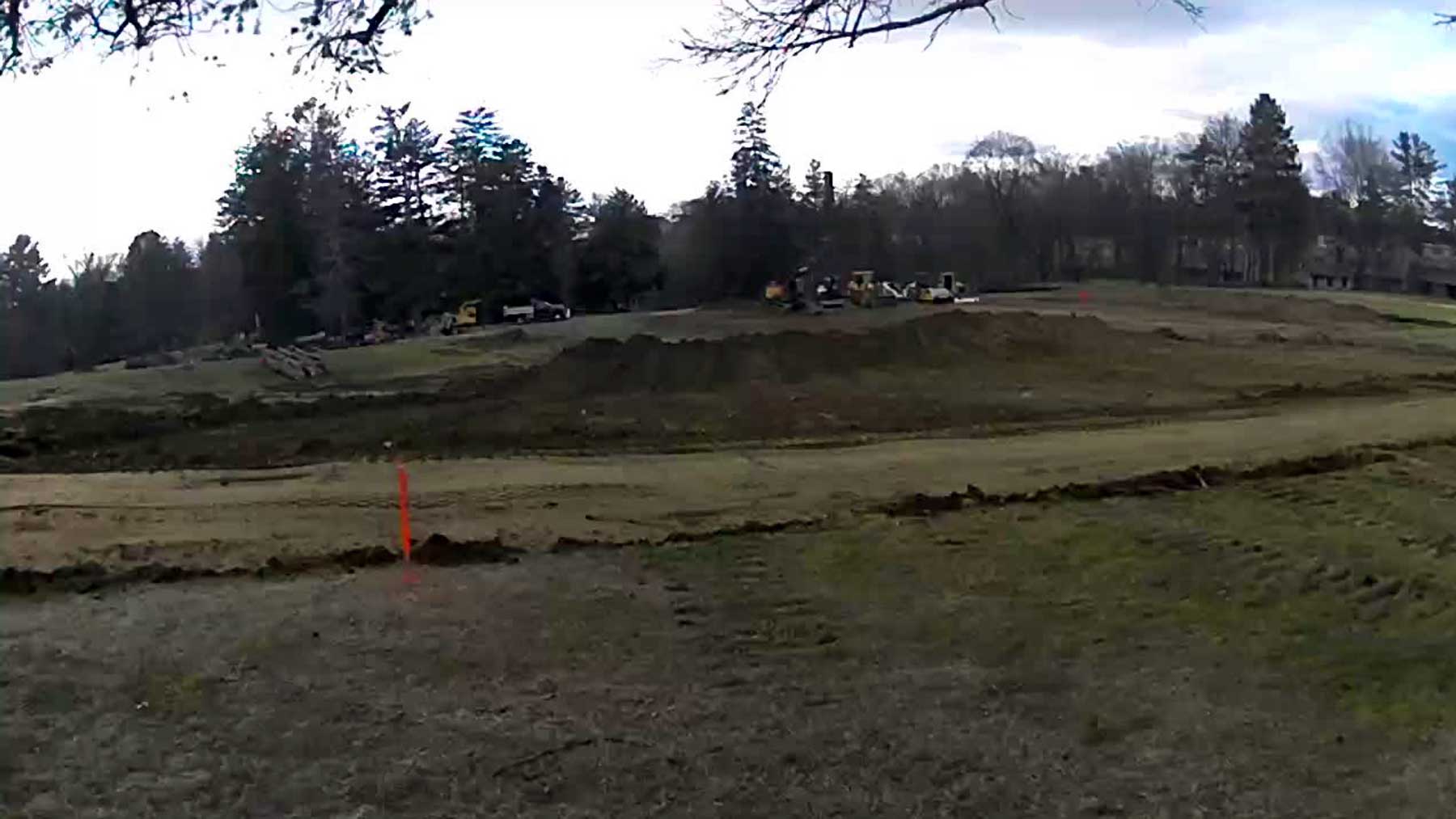 Construction site with a gravel road running through it.
