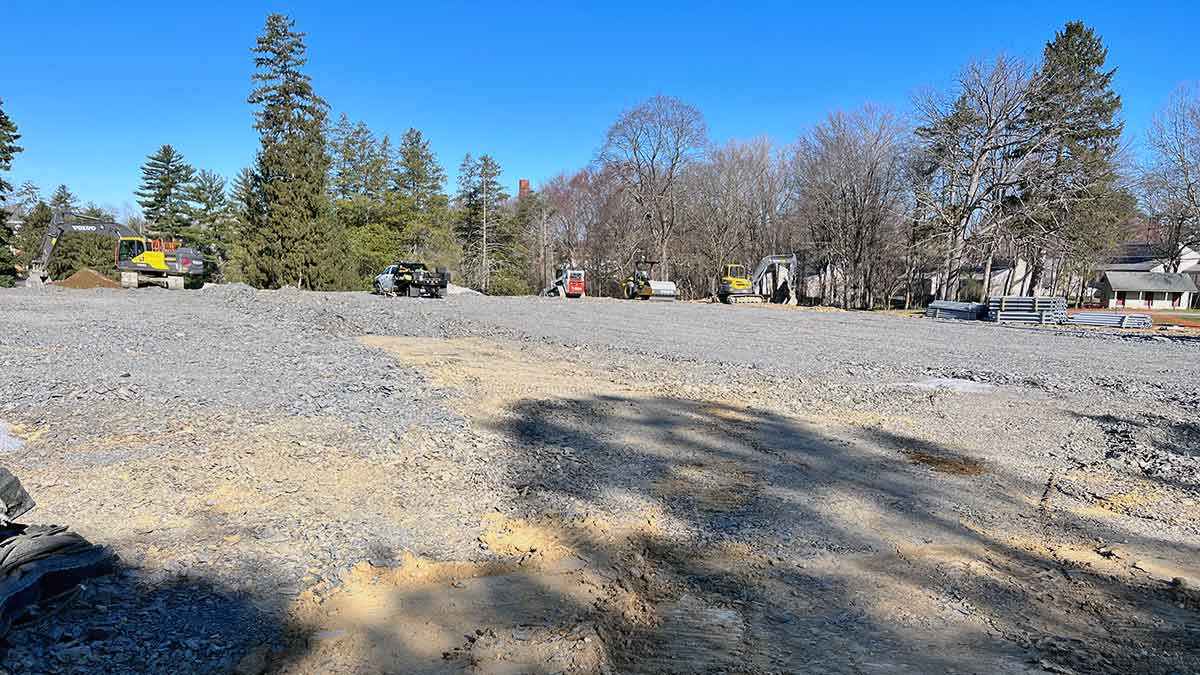 Earth moving equipment on a gravel lot