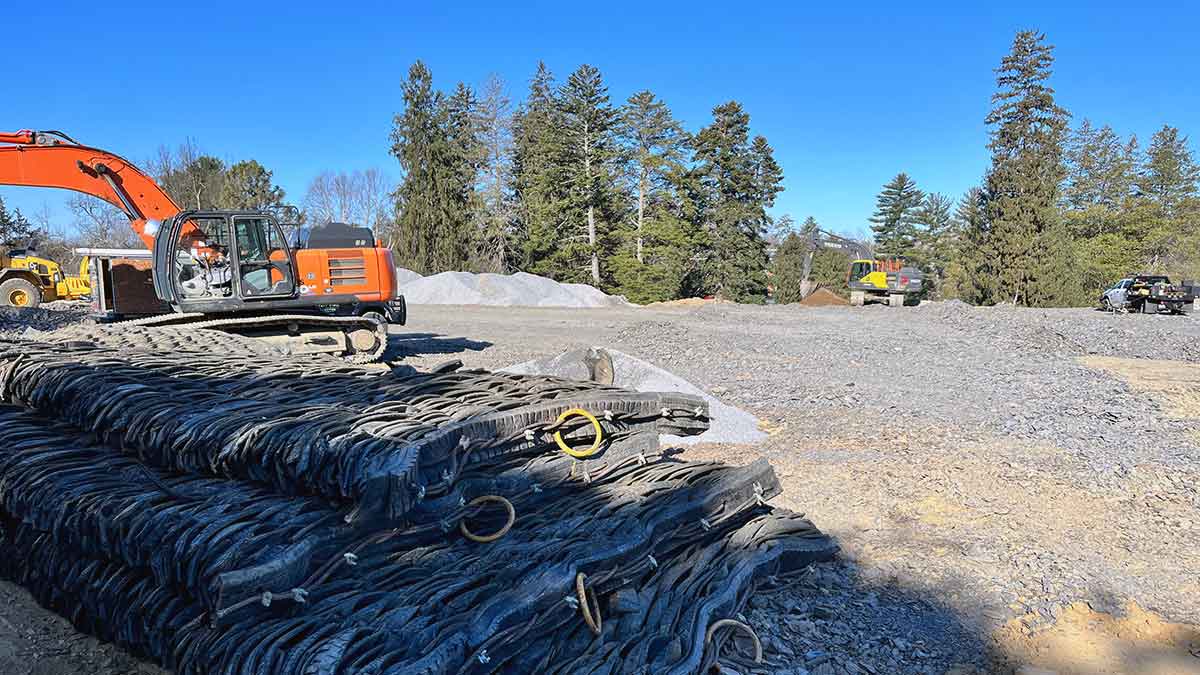 Earth moving equipment on a gravel lot