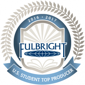Official badge featuring the Fulbright Program logo inside a shield with rays of light and an open book, encircled by laurel leaves. The top reads '2016–2017' and a blue ribbon below states 'U.S. Student Top Producer'.