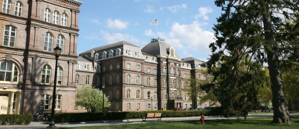 Vassar College main building - a large 5 story red brick building.