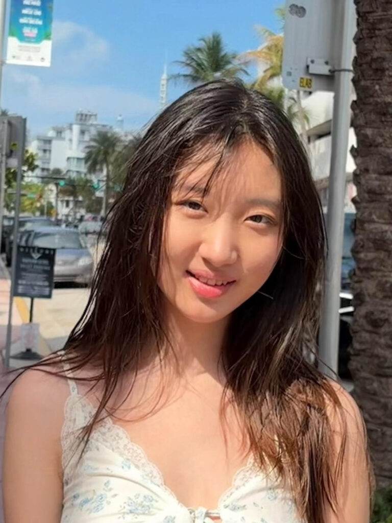 Xiaochen Yu, student intern, smiling at the camera.